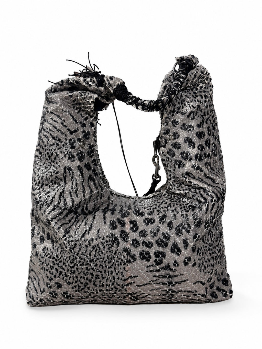A slouchy shoulder bag with a black and gray leopard print pattern, featuring a drawstring closure at the top and a chain detail on the side, shown against a plain white background.